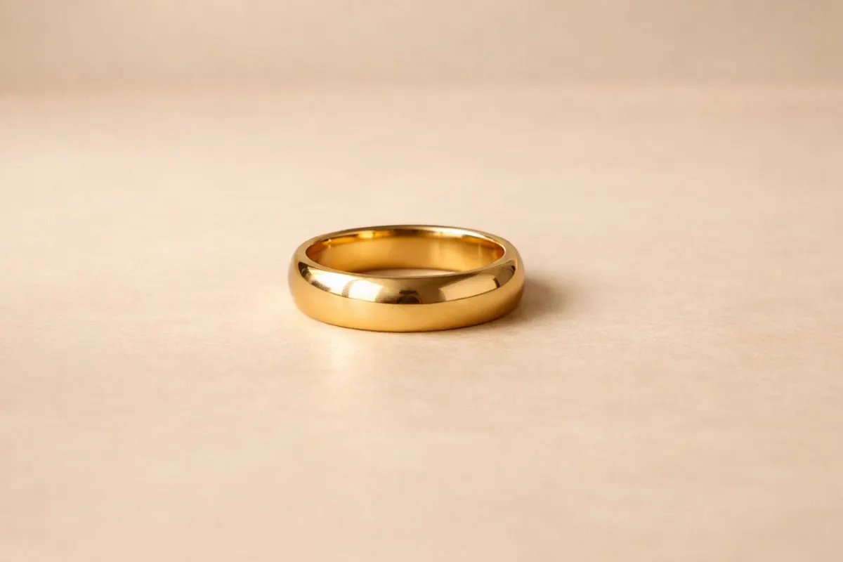 Gold ring on a neutral background for stone, band, setting, and markings